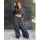 Pantalon con ojalillos metálicos Pantalon con ojalillos metálicos